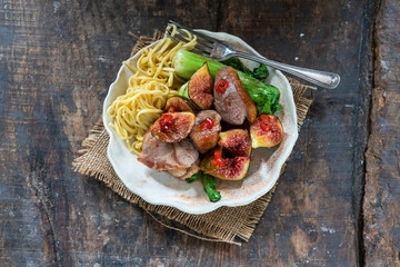 Sticker - Oriental duck fillets with sticky figs, pak choi and egg noodles - top view