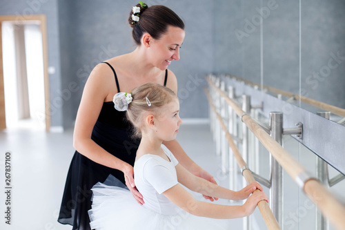 Ballet Teacher And Little Ballerina In Classical Dancing School Female Dance Trainer Is Teaching Kid Girl To Put Hands On Barre Kaufen Sie Dieses Foto Und Finden Sie Ahnliche Bilder Auf