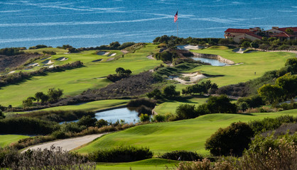 The Trump National Golf Course, in Rancho Palos Verdes along the Pacific coast of California, opened in 2006. Fairway and greens with lakes, sand traps are seen, ocean background with cliffs, bluffs.