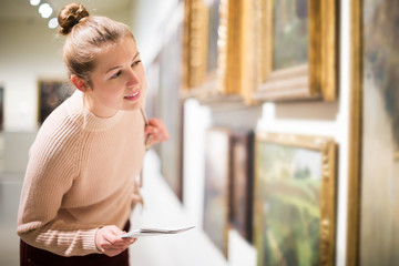 Poster - Woman at exhibition in museum