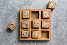 Wooden Tic Tac Toe (O X) Game. The Concept Of Business Strategy And Competition 