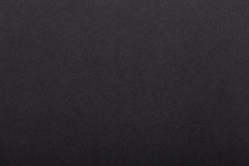 Texture of dark paper. Background for images. copyspace. space for text. sheet of gray craft paper as background. black paper