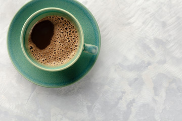 Poster - An overhead closeup photo of a cup of coffee, shot from the top with a place for text