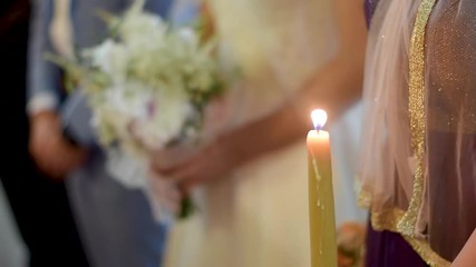 Wall Mural - Candle and bride with wedding bouquet