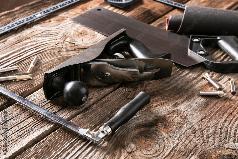 Set of carpenter's tools on wooden background