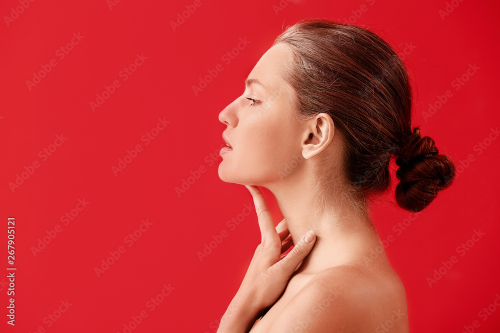 Beautiful young woman on color background