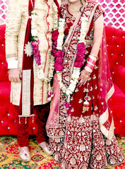 Wall Mural - The bride and groom at the Indian wedding garlands or Jaimala ceremony