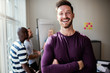 © Flamingo Images - Laughing young designer standing in an office after a presentati