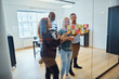 © Flamingo Images - Diverse design team brainstorming with sticky notes in an office