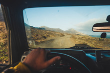 Inside A Car Driving Point Of View For Outdoor Widl Travel Concept With Off Road Vehicle - Beautiful Landscape With Ocean And Mountains For Alternative Traveler Lifestyle People Concept