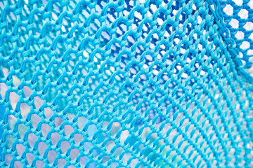 Blue net fabric texture background.