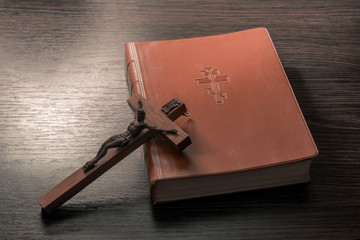 Old Holy Bible and Crucifix. Concept for religious events