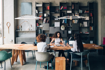 Young women having meeting in a modern office