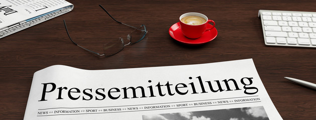 Wall Mural - Pressemitteilung Zeitung auf Schreibtisch als PR Konzept