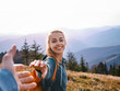 © vitaliymateha - happy attractive woman hiker standing on the mountain slope against background of sunset. Traveling and follow me concept.