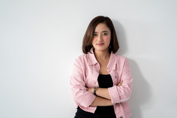 attractive asian young woman looking at camera. portrait of young female over white