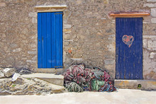 Old Wooden Doors And Fishing Nets In Formentera