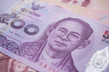 Close up great King Bhumibol Adulyadej (Rama 9) on 500 baht Thai banknotes bill texture background. Concept of Thai baht payment currency of Thailand, Forex investment, stock market