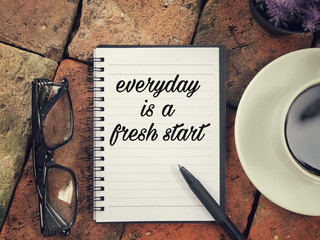 Wall Mural - Motivational and inspirational wording - Everyday Is A Fresh Start written on a notebook.