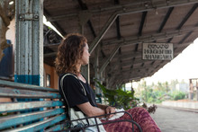 Caucasian Girl Sitting At A Train Station In Sri Lanka