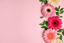 Flat Lay Composition With Beautiful Bright Gerbera Flowers On Color Background, Top View. Space For Text