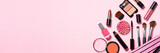 Makeup professional cosmetics on pink background.