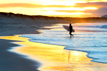 Wall Mural - Silhouette surfer beach sunset Portugal