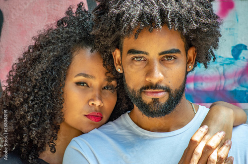Two Lovely African American Young Couple In Candid Affective