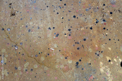 Fototapeta  many decades of built up paint splatterring on concrete wharf