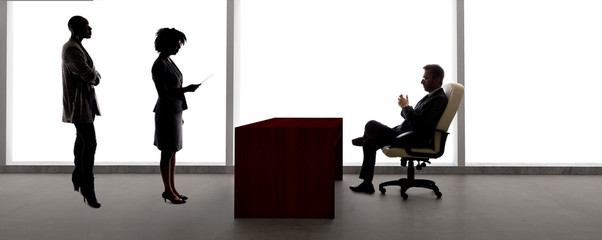 Black African American actress and scene partner auditioning for a role to a male casting director in a studio.  The actors are silhouettes and depicts the Hollywood entertainment industry.