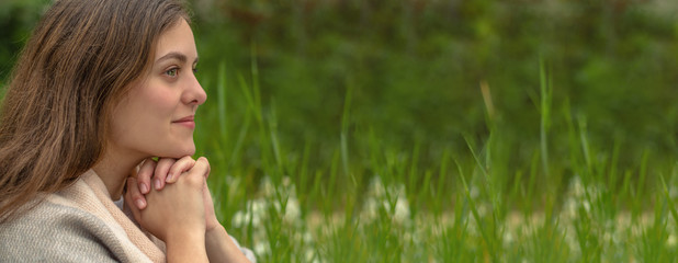 Wall Mural - Christian worship and praise. A young woman is praying in the morning.