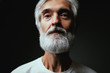 © luengo_ua - Studio portrait of handsome senior man with gray beard.