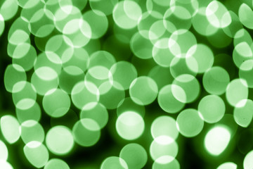 Abstract bokeh background. Soft defocused lights. Neon basic green color