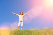 © Dmytro Sunagatov - People freedom success concept. Happy woman dreams to fly on winds. Landscape of grass and flower summer field on sunny day. Nature beauty background, blue sky and green meadow. Outdoor lifestyle.