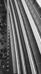 Poster - Abstract black and white image of long balconies and corridors a tmodern office building. Parallel lines