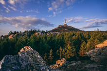 View Of A Sunrise Or Sunset Landscape Of Jizerske Mountains And The Top Of Jested Mountain. Rocks, Forest And Dramatic Sky Over The Jested Summit.