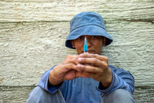 Labor Workers Hold Syringe Serious Drugs Which Is Illegal In The Country. Man Who Drug Addict Holding Serious Syringe