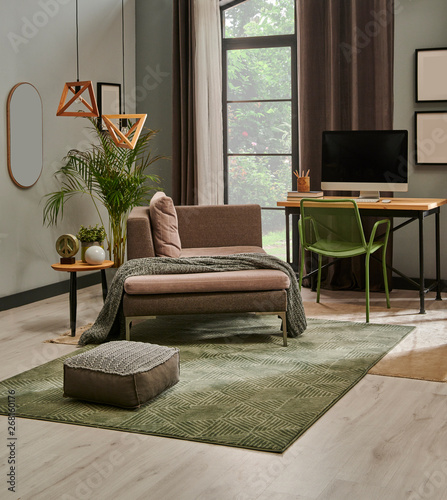 Modern Living Room With Grey Sofa And Frame Green Wall Close Up