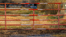 Clear Panorama No Trespassing Sign On The Gate Of A Private Property Viewed On A Sunny Day