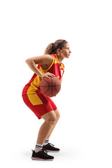 Wall Mural - Female basketball player passing a ball