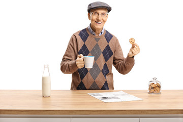 Wall Mural - Senior posing with a cup and a biscuit