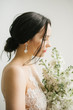 © Dreamwood - Michael & Lucy/Stocksy - Wonderful bride in veil with floral bouquet