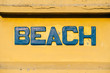 © Sam Burton/Stocksy - Beach sign
