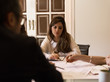 © Milles Studio/Stocksy - Woman taking part in business conference