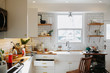 © Rob and Julia Campbell/Stocksy - Messy modern kitchen