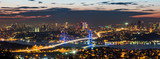 Fototapeta  - Istanbul Bosphorus Bridge at sunset. 15th July Martyrs Bridge. Night view from Camlica Hill. Istanbul, Turkey.