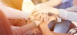 © BillionPhotos.com - Group of people stacking hands together