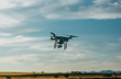 © MyMicrostock/Stocksy - Drone flying over the countryside at sunset