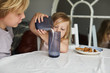© sally anscombe/Stocksy - Children having breakfast
