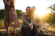 © Rob and Julia Campbell/Stocksy - Happy family enjoying outdoors at sunset